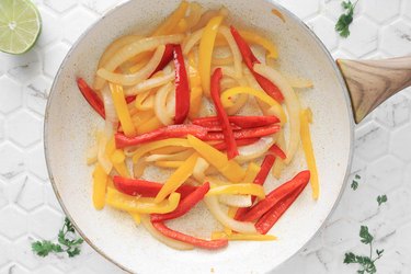 Cook peppers and onions