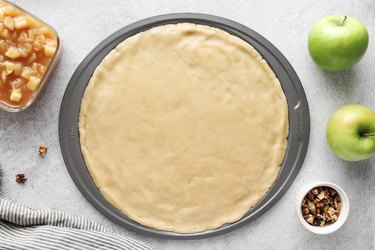 Add cookie dough to a nonstick pizza pan