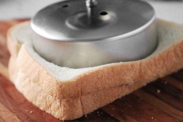 Press sandwich cutter into the bread