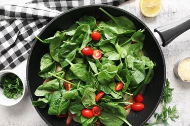 Add spinach and tomatoes