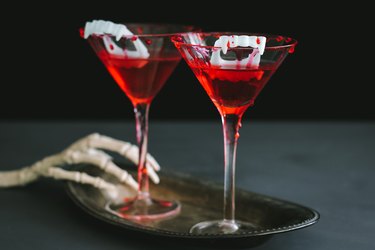 Halloween vampire cocktail with blood dripping