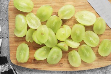 Slice grapes in half