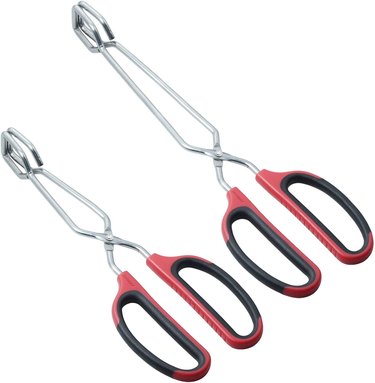 Two pairs of scissor-type tongs on a white ground