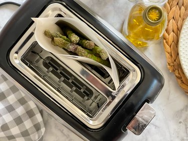raw asparagus in a toaster