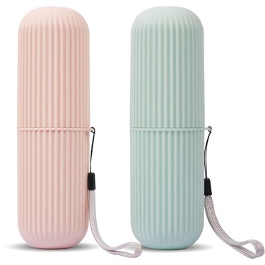 Two travel toothbrush holders