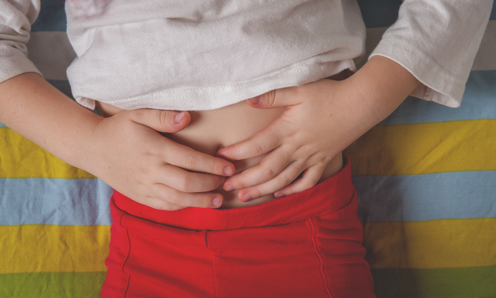 Closeup of Child Holding Stomach